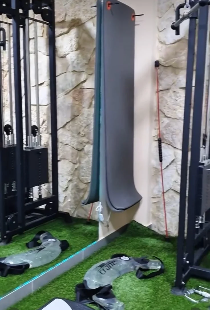 Cable machine and stone wall in the Movyo rehab gym
